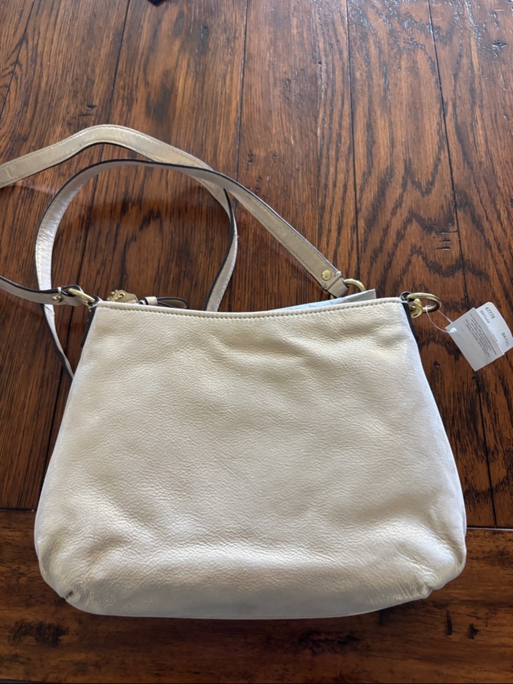 Coach Metallic Champagne Pebble Leather Crossbody
1 small indent from storing. - Picture 2 of 4